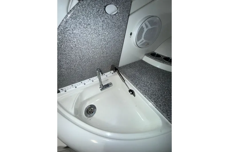 Slide: The Image of 2004 Formula 34 Performance Cruiser in storage, blue hull, indoor facility. - 37