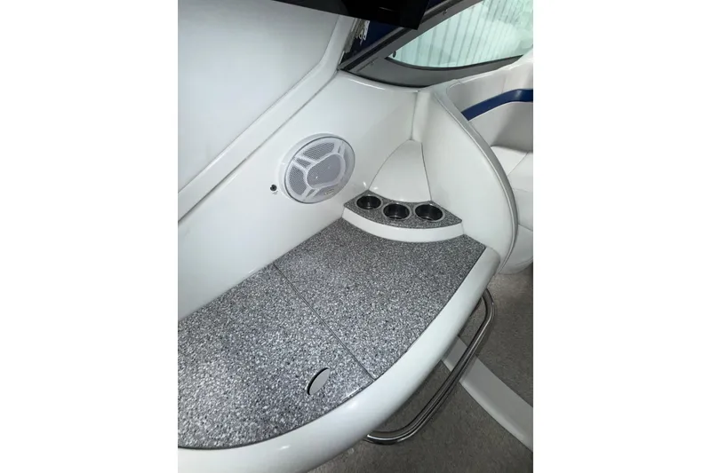 Slide: The Image of 2004 Formula 34 Performance Cruiser in storage, elevated on stands, inside a spacious warehouse. - 38