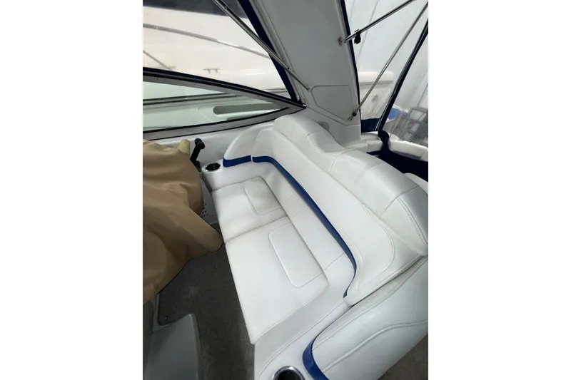Slide: The Image of 2004 Formula 34 Performance Cruiser in storage, showcasing sleek blue hull design. - 39