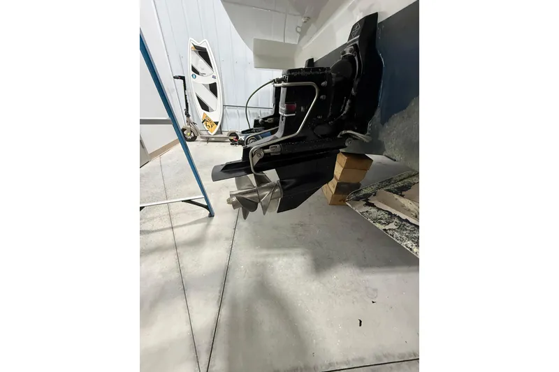 Slide: The Image of 2004 Formula 34 Performance Cruiser propeller and stern drive in a garage setting. - 42