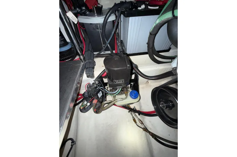 Slide: The Image of 2004 Formula 34 Performance Cruiser boat deck in storage, featuring sleek design and accessories. - 9