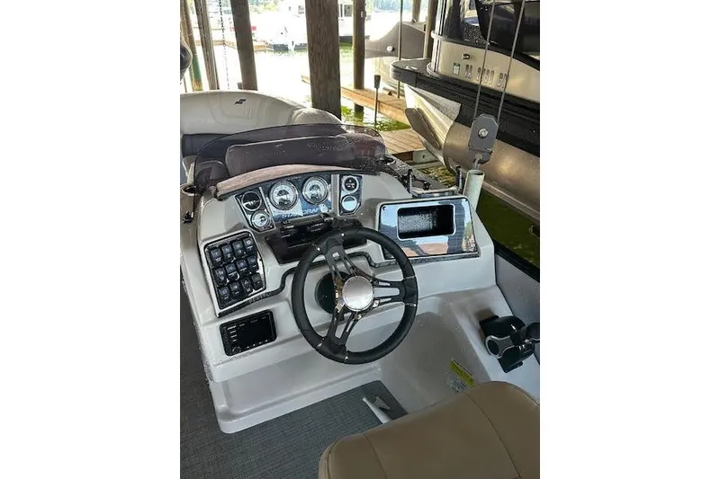 Slide: The Image of 2020 Starcraft SLS 3 boat dashboard with steering wheel and control panel. - 8