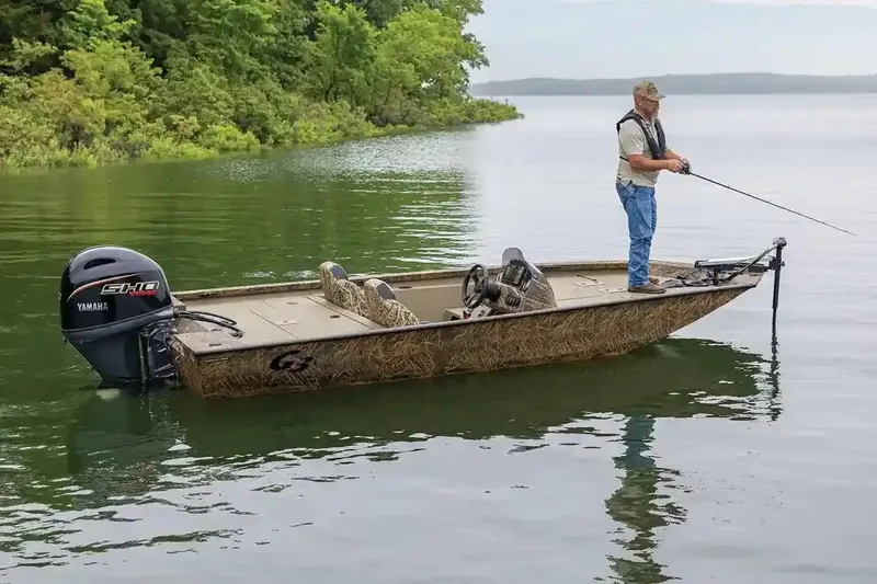The Image of Manufacturer Provided Image: Man fishing on a 2026 G3 Sportsman 1710 boat in a serene lake. - 0