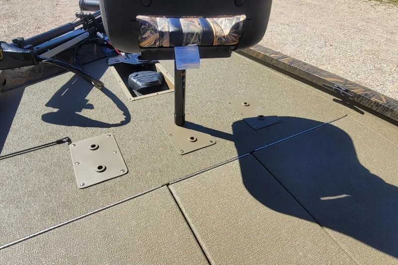 Slide: The Image of 2026 G3 Sportsman 1710 boat deck with mounted seat and fishing equipment. - 14