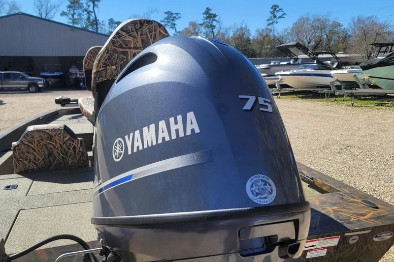 Slide: The Image of 2026 G3 Sportsman 1710 boat with Yamaha 75 engine in outdoor setting. - 18