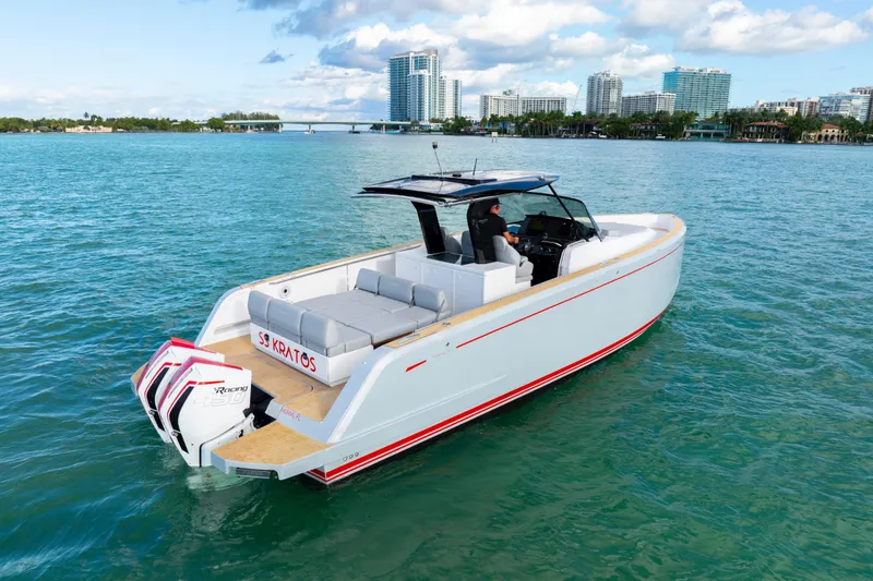 Slide: The Image of 2021 Pardo Yachts 38 cruising on clear blue waters near a city skyline. - 15