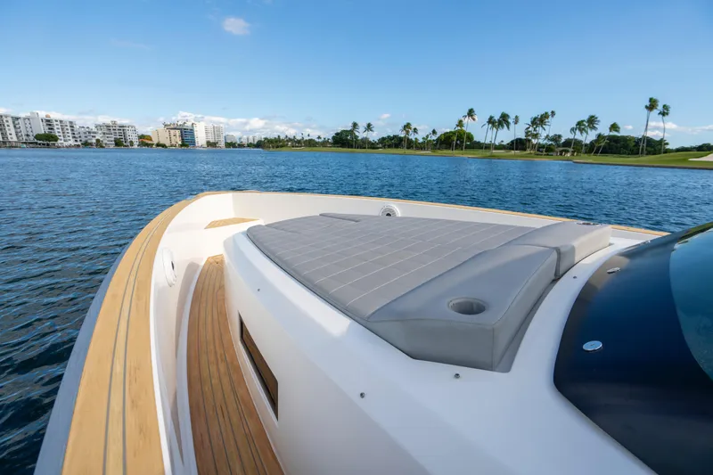 Slide: The Image of 2021 Pardo Yachts 38 cruising on clear blue waters near a city skyline. - 40