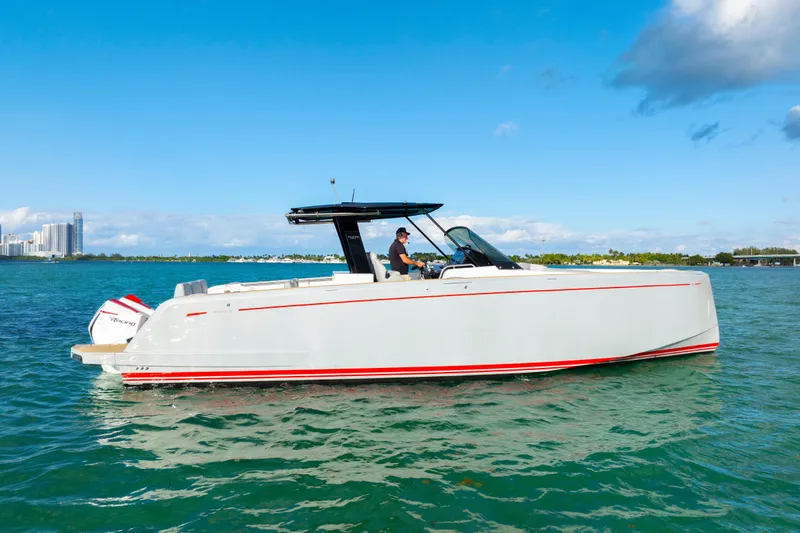 Slide: The Image of Luxury seating on 2021 Pardo Yachts 38, overlooking serene water and lush greenery. - 48