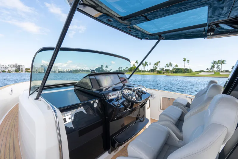 Slide: The Image of 2021 Pardo Yachts 38 cruising on water near coastal buildings. - 53