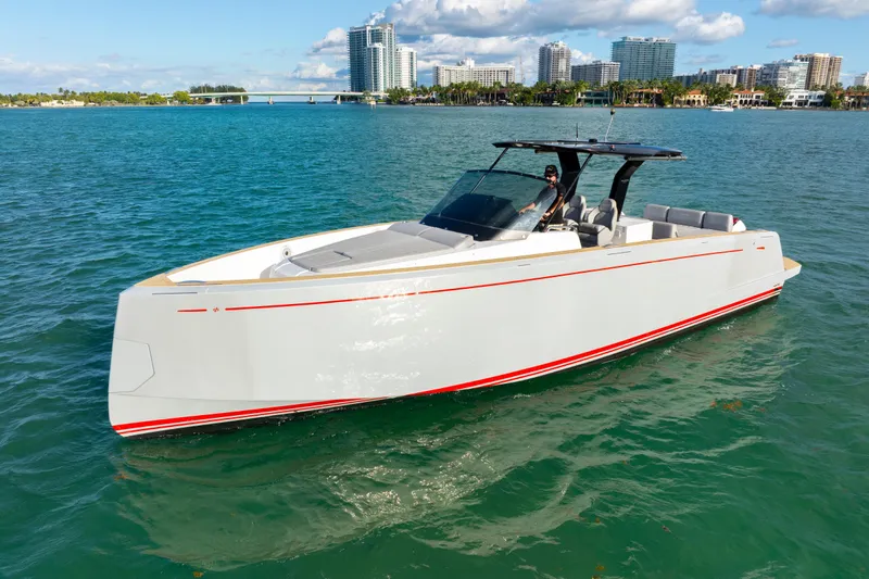 Slide: The Image of 2021 Pardo Yachts 38 cruising on blue water with city skyline in background. - 16