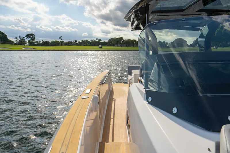 Slide: The Image of 2021 Pardo Yachts 38 cruising on water near coastal buildings. - 34