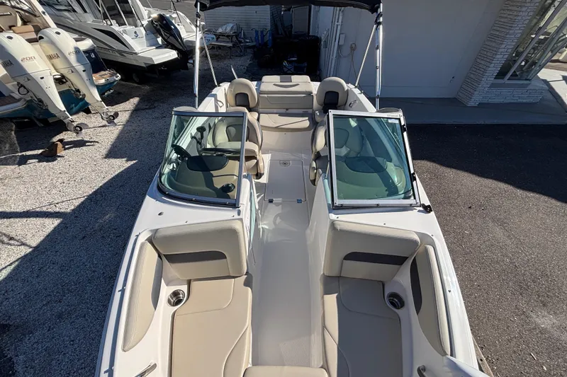 Slide: The Image of 2015 Chaparral 19 H2O Ski & Fish boat interior with seating and windshield. - 13