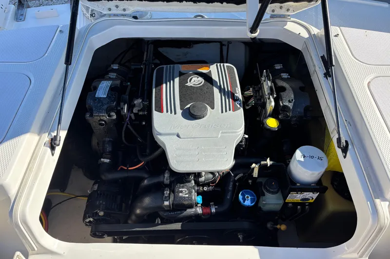 Slide: The Image of Engine compartment of 2015 Chaparral 19 H2O Ski & Fish boat, featuring MerCruiser engine. - 18