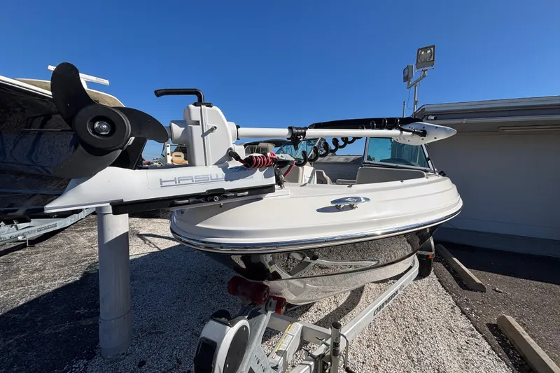 Slide: The Image of 2015 Chaparral 19 H2O Ski & Fish boat on trailer, sunny day. - 3