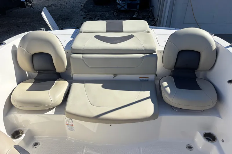 Slide: The Image of 2015 Chaparral 19 H2O Ski & Fish boat interior seating with beige upholstery. - 7