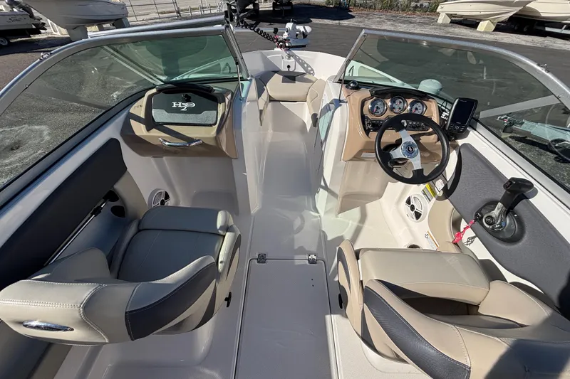 Slide: The Image of 2015 Chaparral 19 H2O Ski & Fish boat interior with steering wheel and seating. - 8