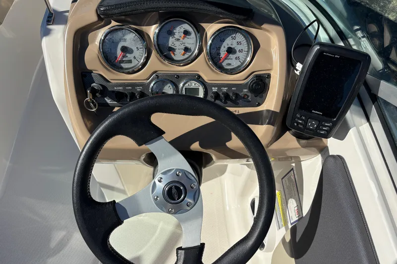 Slide: The Image of Steering console of 2015 Chaparral 19 H2O Ski & Fish with gauges and Garmin device. - 9