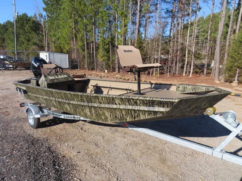 Slide: The Image of 2026 SeaArk 1648 Special Suzuki 30 on trailer outdoors. - 22