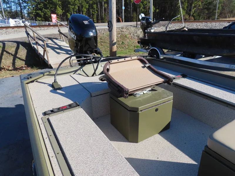 Slide: The Image of SeaArk 1652 Crappie boat with Suzuki 40 motor, trailer in background. - 16