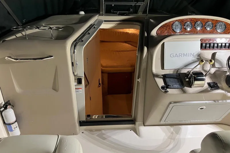 Slide: The Image of 2007 Sea Ray 270 Amberjack cabin entrance and helm with Garmin navigation system. - 7