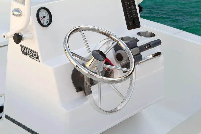 Slide: The Image of Manufacturer Provided Image: 2019 Robalo R160 Center Console boat steering wheel and control panel. - 6