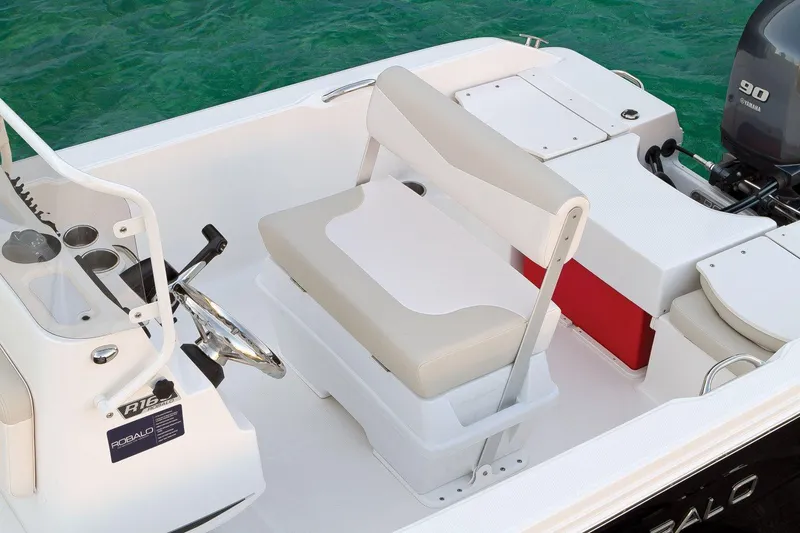 Slide: The Image of Manufacturer Provided Image: 2019 Robalo R160 Center Console boat interior with seating and steering wheel. - 7
