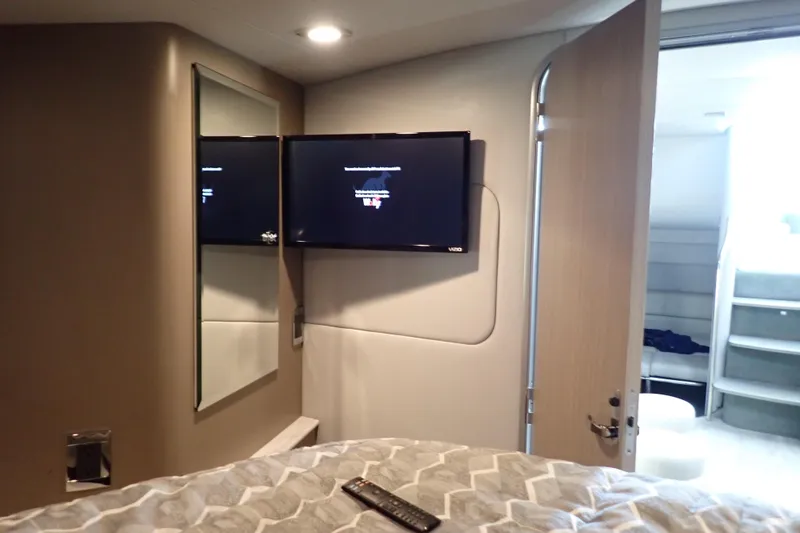 Slide: The Image of Interior of 2020 Formula 40 Performance Cruiser with TV, mirror, and open door. - 11