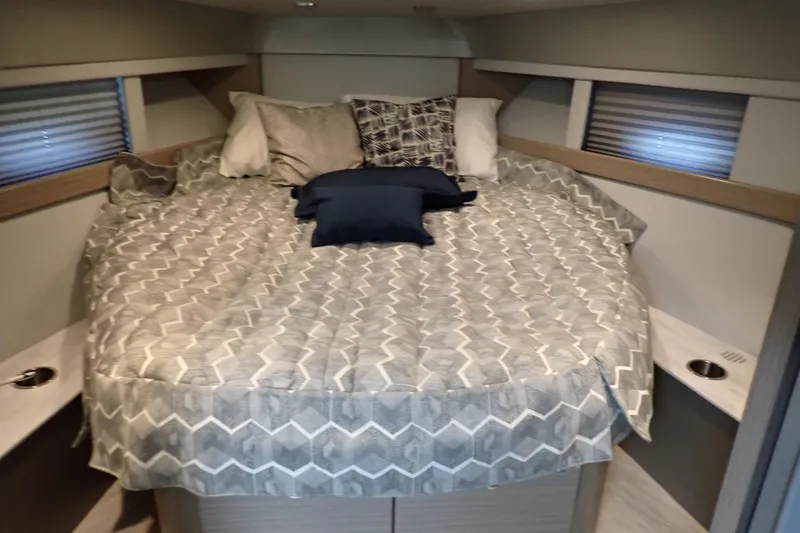 Slide: The Image of Cozy bedroom interior of 2020 Formula 40 Performance Cruiser with patterned bedding and pillows. - 14