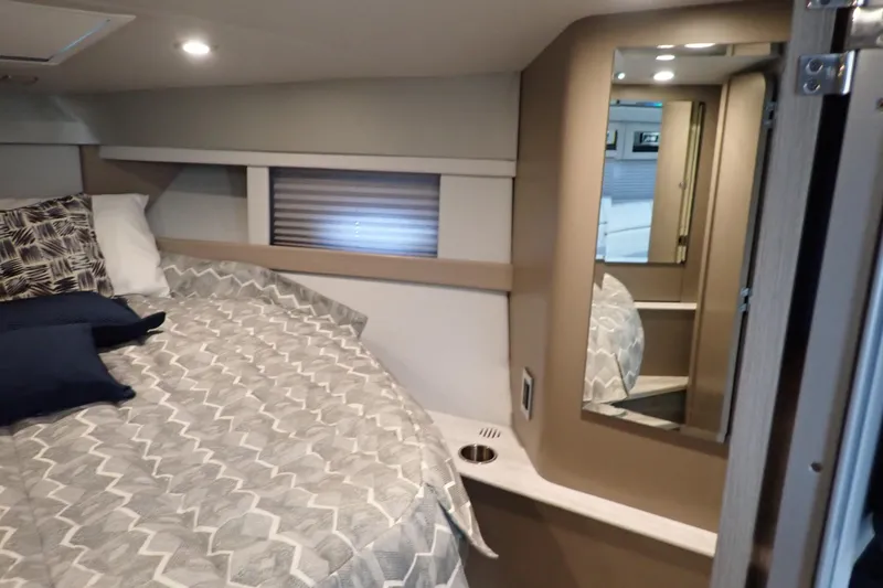 Slide: The Image of Cozy interior cabin of 2020 Formula 40 Performance Cruiser with bed and mirror. - 15