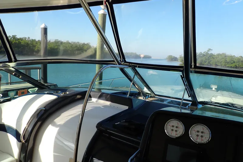 Slide: The Image of Cockpit view of 2020 Formula 40 Performance Cruiser on serene waterway. - 20