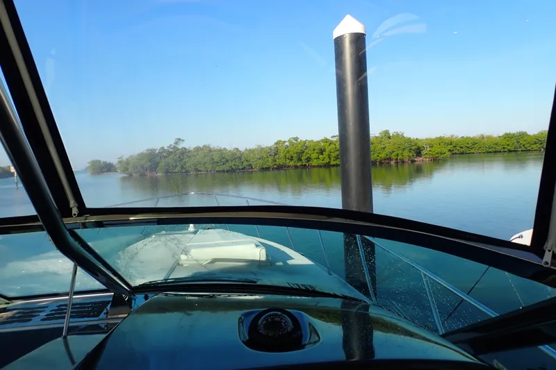 Slide: The Image of 2020 Formula 40 Performance Cruiser navigating calm waters with lush greenery. - 21