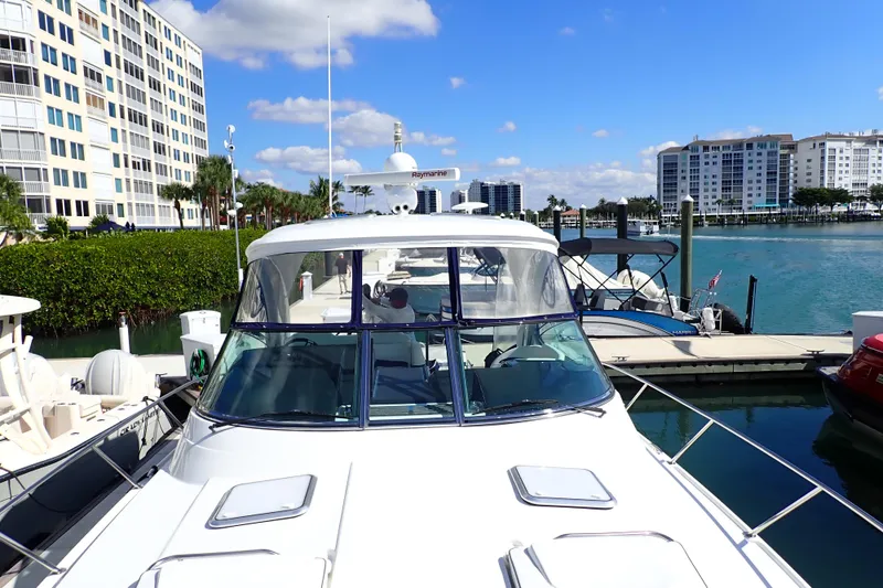 Slide: The Image of 2020 Formula 40 Performance Cruiser docked at marina with waterfront buildings. - 36