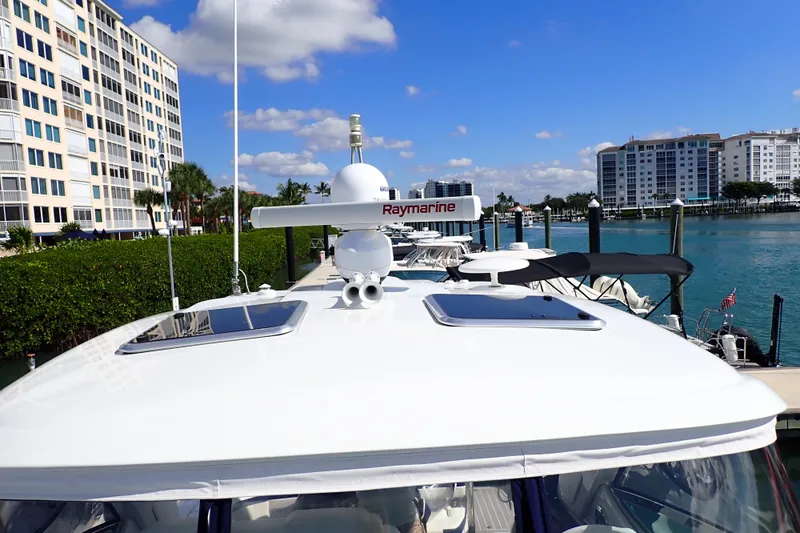 Slide: The Image of 2020 Formula 40 Performance Cruiser docked near waterfront buildings under blue sky. - 38
