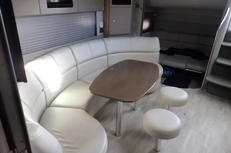 Slide: The Image of Interior of 2020 Formula 40 Performance Cruiser with white leather seating and wooden table. - 5