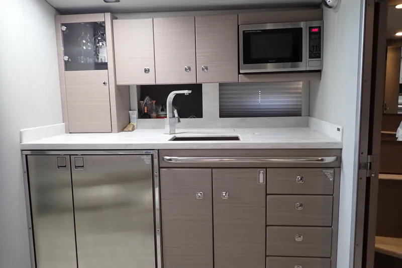 Slide: The Image of Modern kitchen in 2020 Formula 40 Performance Cruiser with stainless steel appliances and sleek cabinetry. - 9