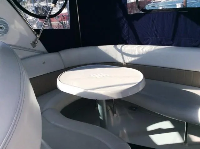Slide: The Image of Interior of a 2006 Four Winns 328 Vista yacht with seating area. - 11