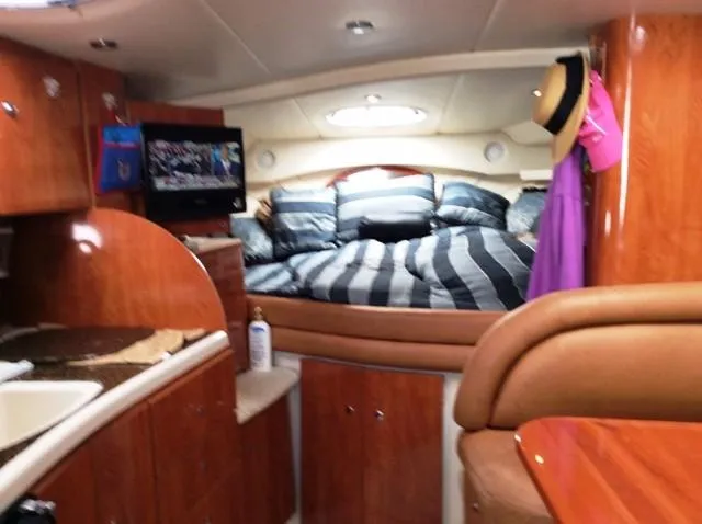 Slide: The Image of Interior of 2006 Four Winns 328 Vista yacht with bed and TV. - 12