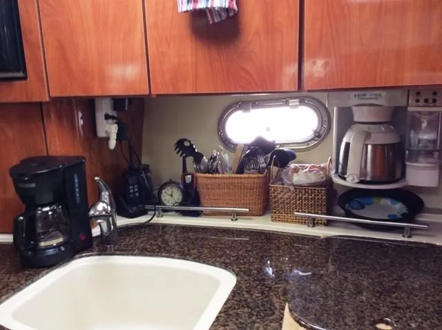 Slide: The Image of 2006 Four Winns 328 Vista yacht kitchen area with coffee maker and sink. - 13