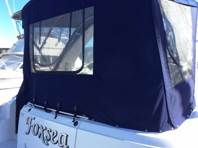 Slide: The Image of 2006 Four Winns 328 Vista boat with blue cover in harbor. - 5