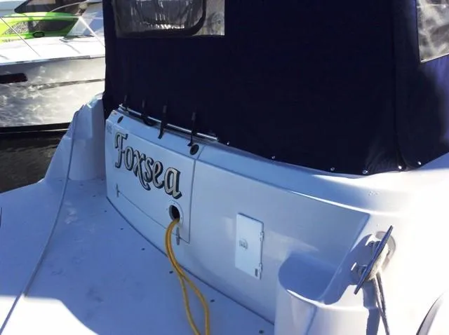 Slide: The Image of 2006 Four Winns 328 Vista boat stern view with cover. - 6
