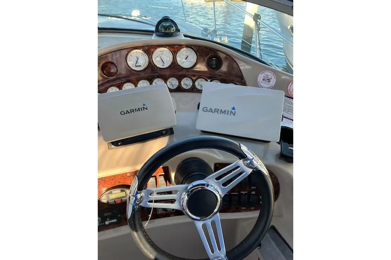 Slide: The Image of 2006 Four Winns 328 Vista boat dashboard with Garmin navigation systems. - 8