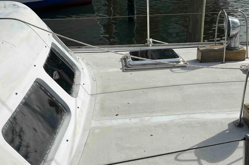 Slide: The Image of 1980 Wellington 44 Cutter Center Cockpit deck with windows and rigging details. - 11