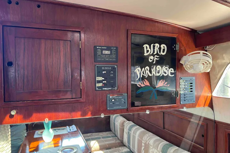 Slide: The Image of Interior of 1980 Wellington 44 Cutter Center Cockpit with "Bird of Paradise" artwork. - 19