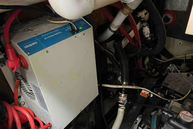 Slide: The Image of Electrical system inside 1980 Wellington 44 Cutter Center Cockpit, featuring Xantrex Freedom Marine 30. - 51