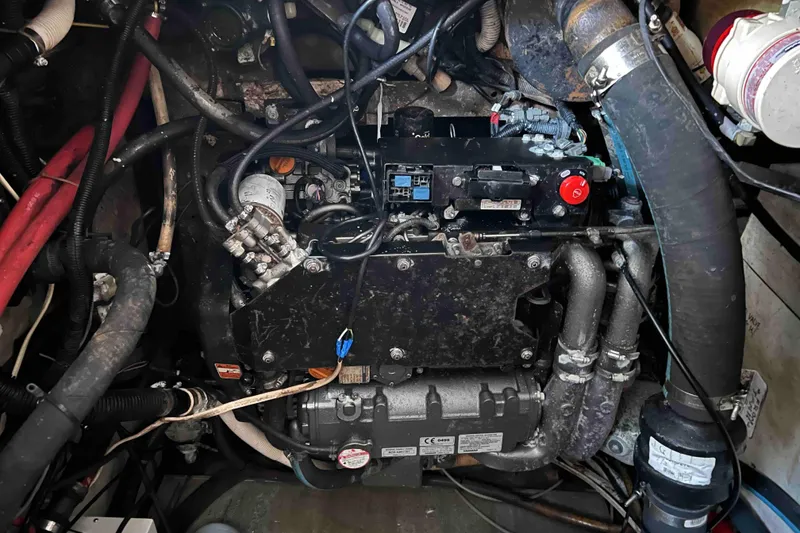 Slide: The Image of Engine compartment of a 1980 Wellington 44 Cutter Center Cockpit sailboat, showing detailed components. - 52