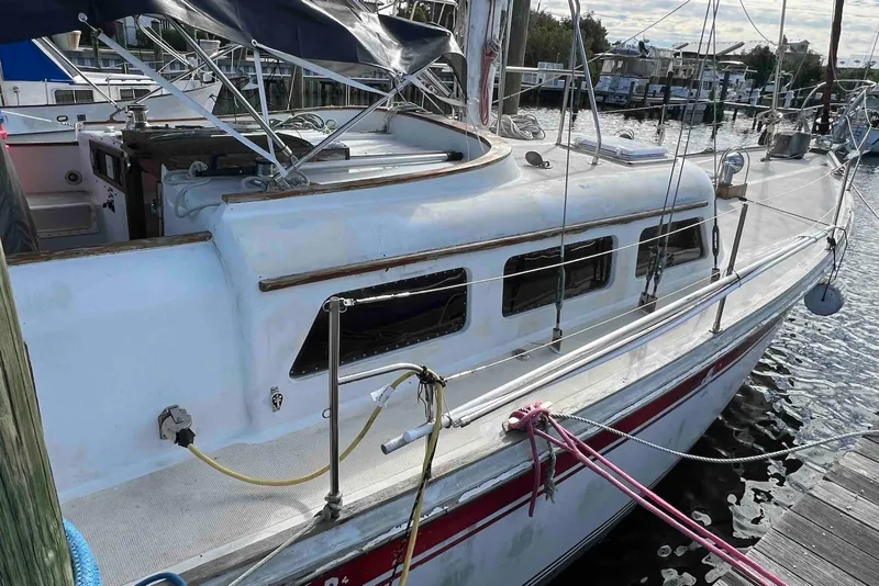 Slide: The Image of 1980 Wellington 44 Cutter Center Cockpit sailboat docked at marina. - 8