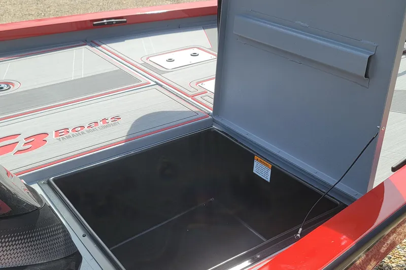 Slide: The Image of 2026 G3 Sportsman 1710 SE boat storage compartment open, showcasing interior space. - 17