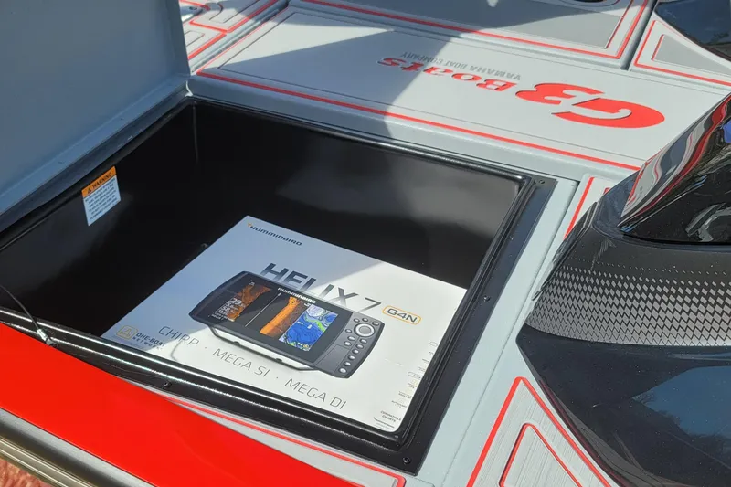 Slide: The Image of 2026 G3 Sportsman 1710 SE boat with Humminbird Helix 7 fish finder in storage compartment. - 18