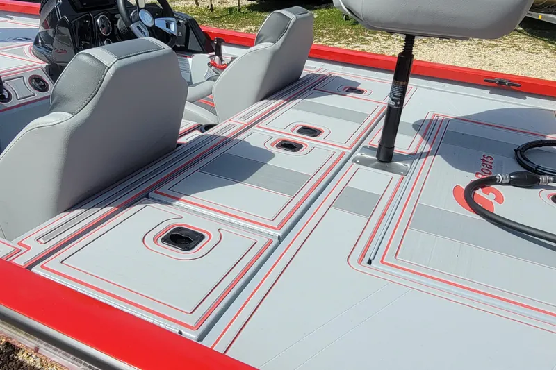 Slide: The Image of 2026 G3 Sportsman 1710 SE boat interior with gray and red seating and deck design. - 19