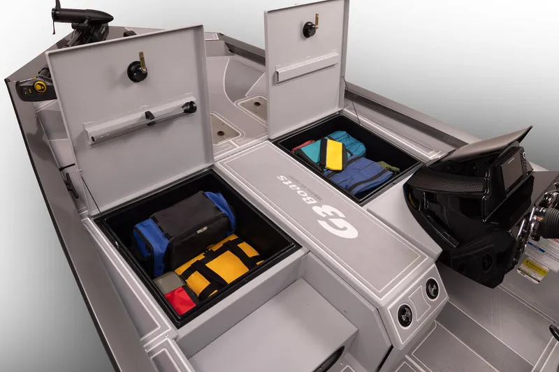 Slide: The Image of 2026 G3 Sportsman 1710 SE boat with open storage compartments and gear. - 31